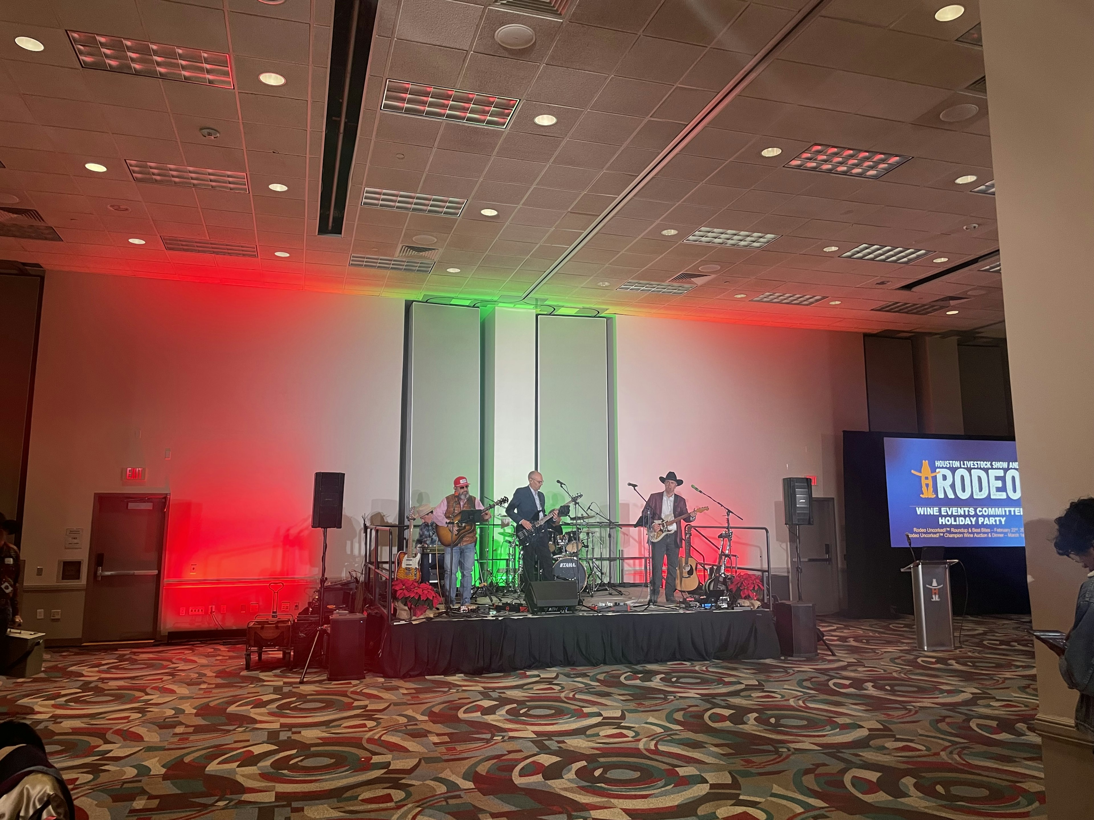Texas Sunset Band performing with guitars and drums on stage