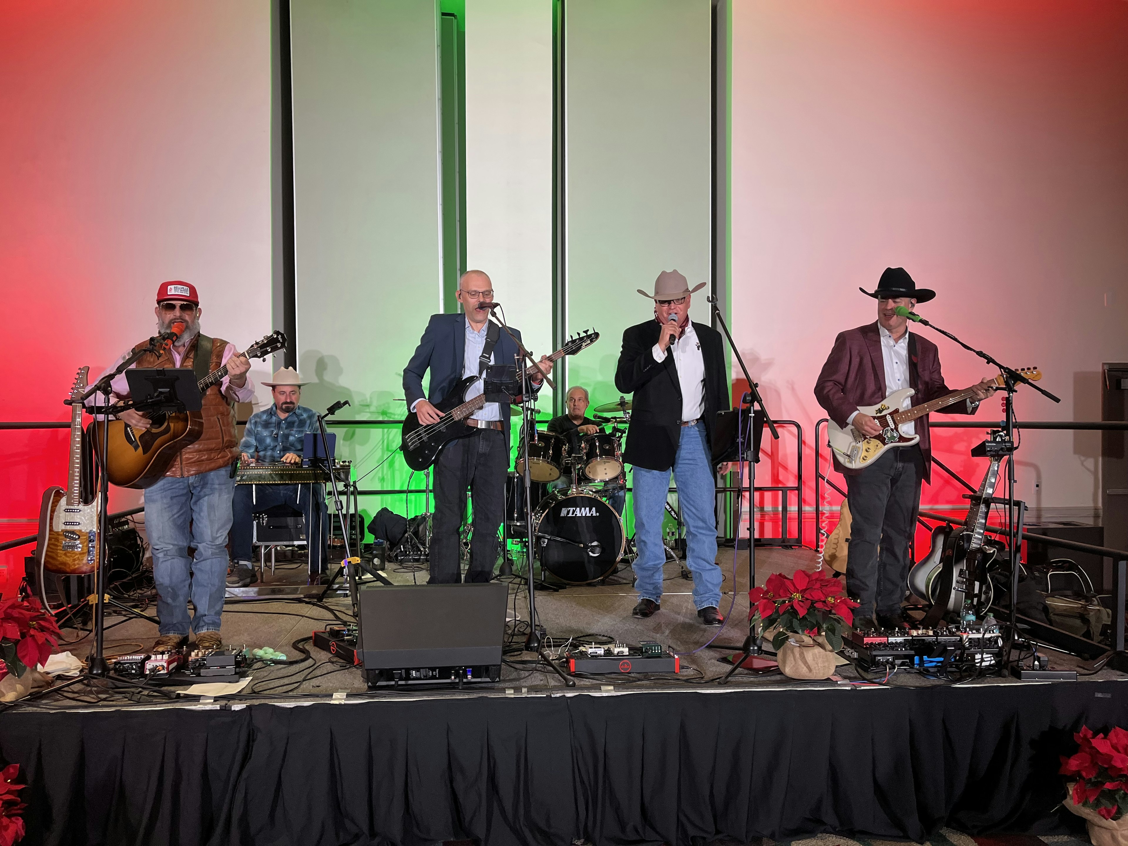 Wide shot of Texas Sunset Band playing at an indoor venue